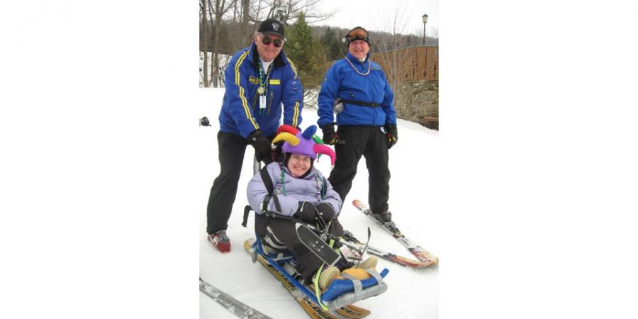 adaptive ski lesson with girl and instructor