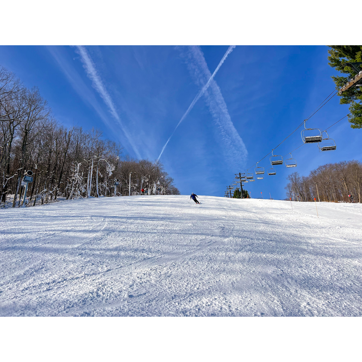 Bristol Opening day - sunshine and snow and a skier!