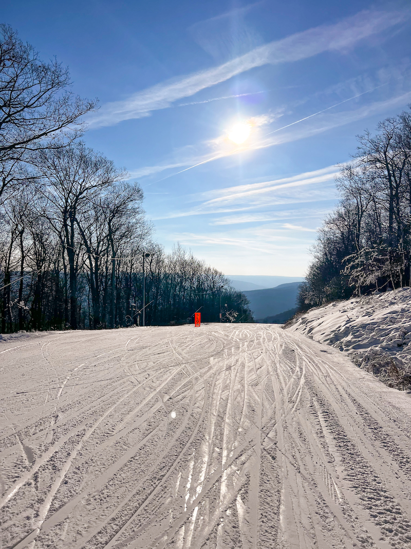 View from the top of a Bristol Ski Trail on a bluebird sunny day