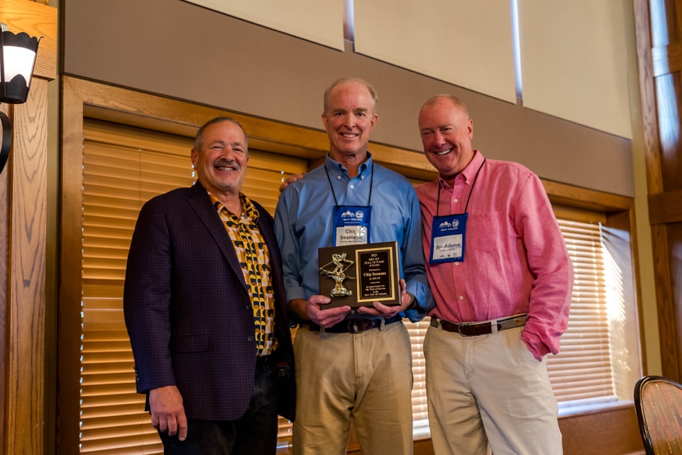 A group of men holding a trophy</p>
<p>AI-generated content may be incorrect.