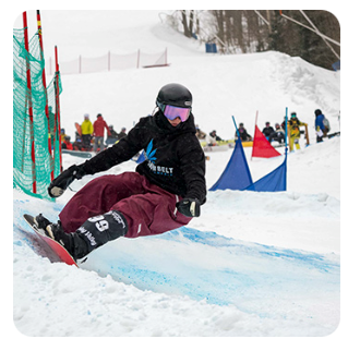 Snowboarder on the banked slalom course