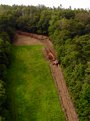 Installing snowmaking pipe