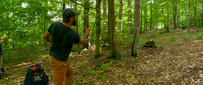 Disc Golfer in Woods